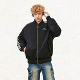 Model wearing the black Double-sided Loose Classic Jacket  in a gray background 
