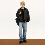 Model wearing the black Vintage Deconstructed Stitching Denim Jacket  in a gray background 