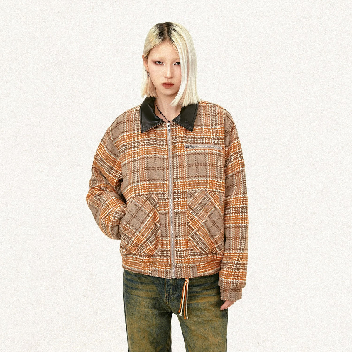 Model wearing the khaki Loose Retro Plaid Striped Jacket in a gray background 