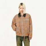 Model wearing the khaki Loose Retro Plaid Striped Jacket in a gray background 