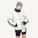 Model wearing the grey Classic Loose Puffer Jacket in a gray background 
