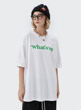 A girl wearing white What's up t shirt
